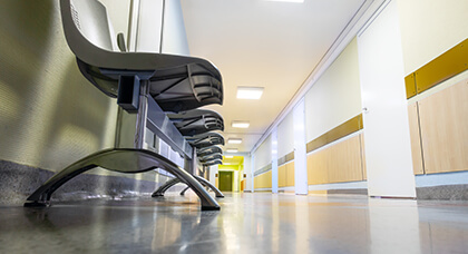 Commercial Cleaning row of sitting in hospital hallway to represent the floor care cleaning work we do